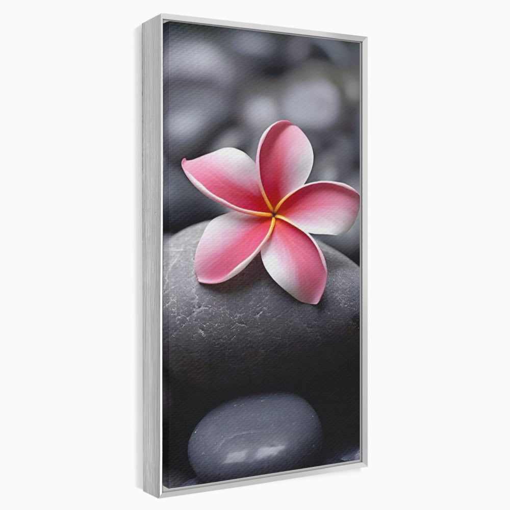 Tablou canvas cu floare roz pe pietre gri, in rama de aluminiu argintiu